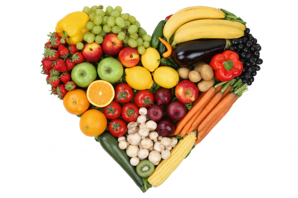 Fruits and vegetables forming heart love topic and healthy eating
